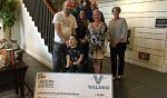 Check Presented to Families and Staff of the Long Beach House 