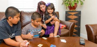 Family Playing a Card Game
