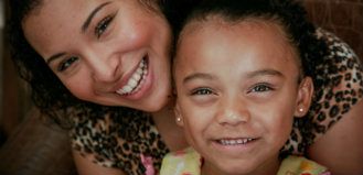 Mother and Daughter sharing a smile 