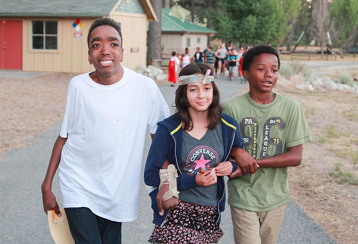 Friends pose for a picture at camp